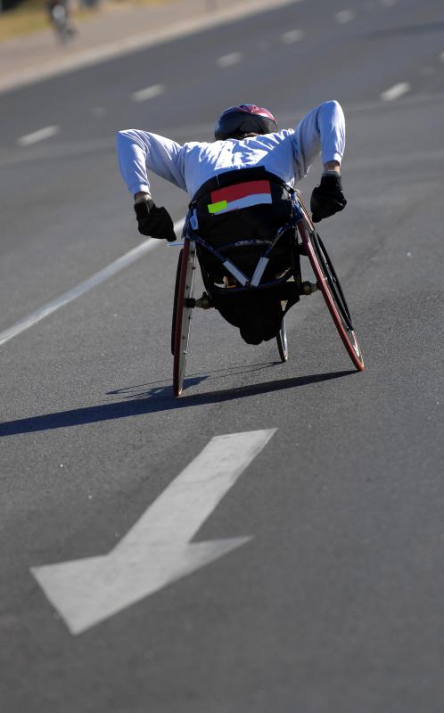 Athlete racing in a wheelchair.