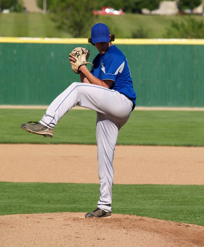 A pitcher in a baseball uniform.