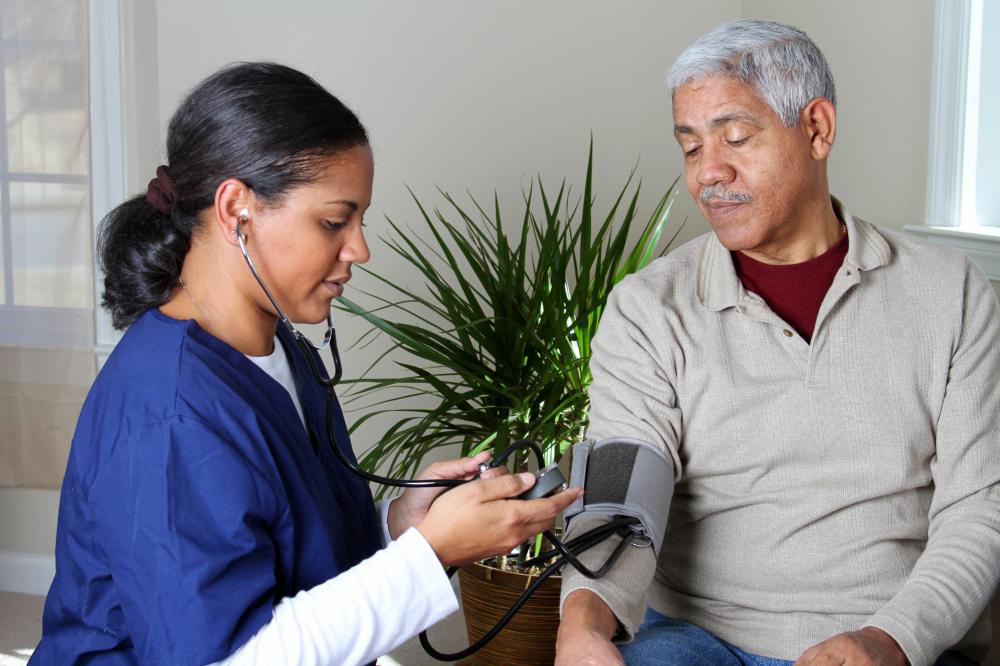 A medical professional checks a man's blood pressure. Eating too much salt may affect a person's blood pressure.