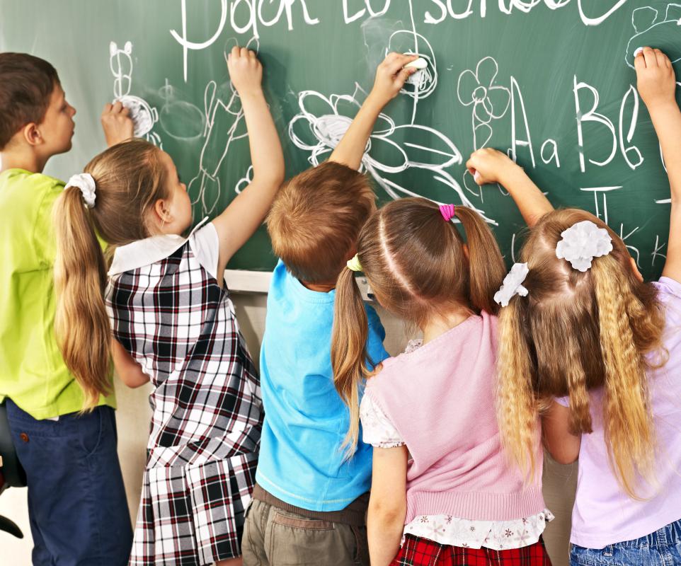 A child with visual processing disorder may have difficulty recognizing objects and words on a chalkboard.