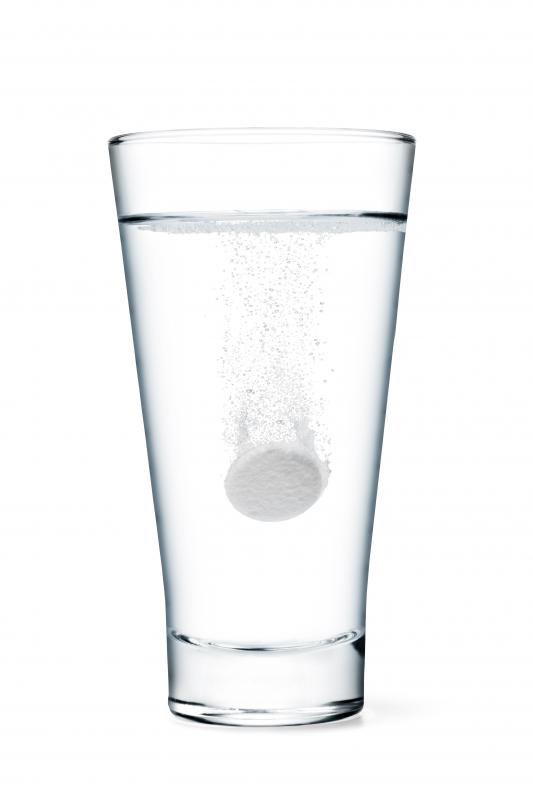Effervescent vitamin C fizzes and dissolves in water.