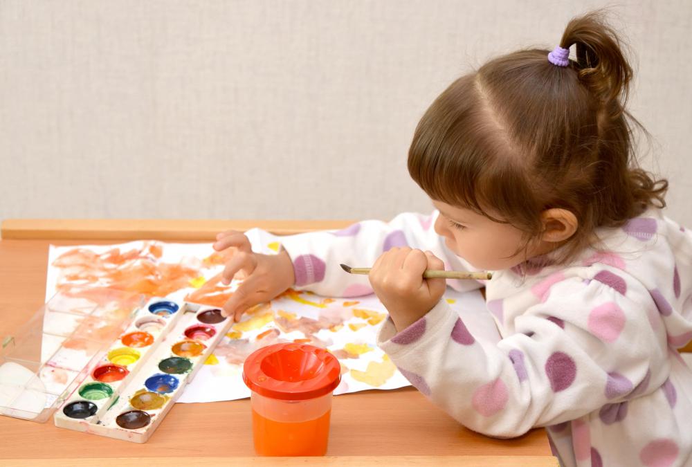 Activities like painting often help to stimulate brain development in children.