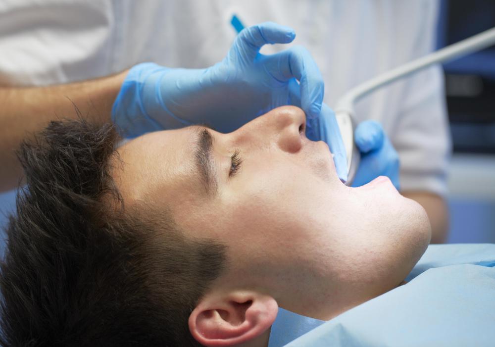 Osseointegration is a process in which implanted material -- such as a dental implant -- integrates with living bone.