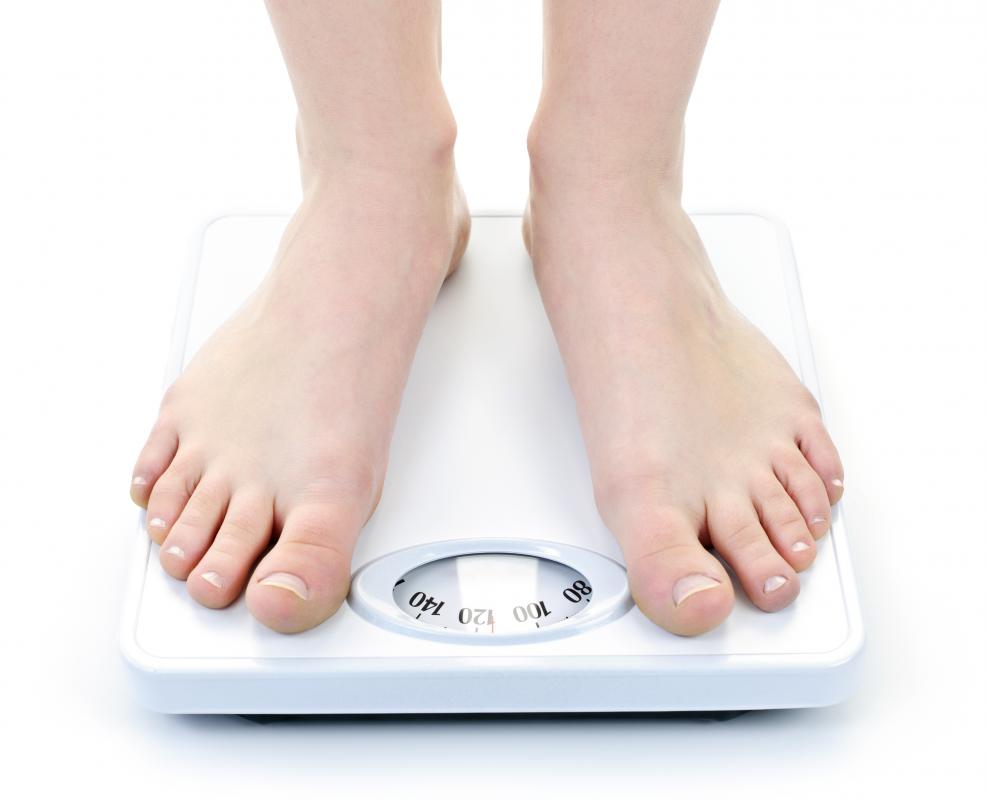 Weighing yourself on a bathroom scale is helpful when trying to lose weight.