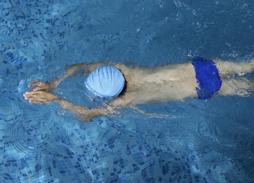 A swimmer's build is not necessarily caused by swimming, nor is is found only among swimmers.