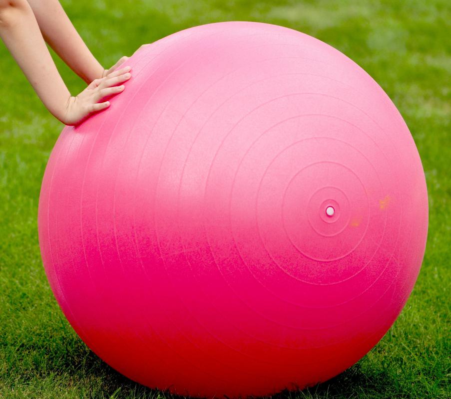 An exercise ball is a popular form of exercise equipment.