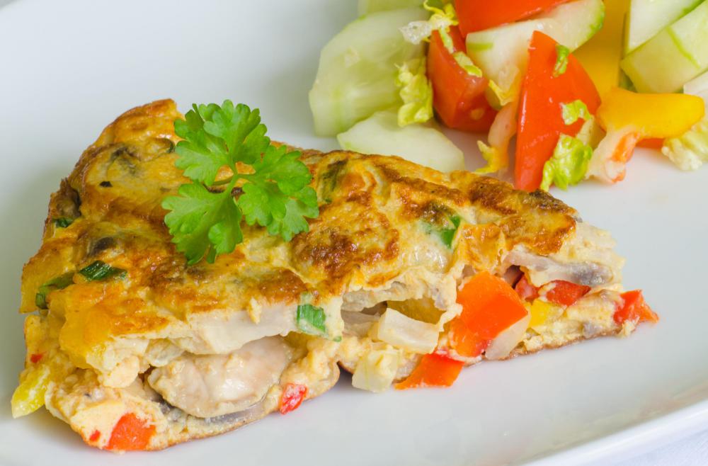 A crustless egg and vegetable quiche is a nutritious continental breakfast item that is low in carbs and high in protein.