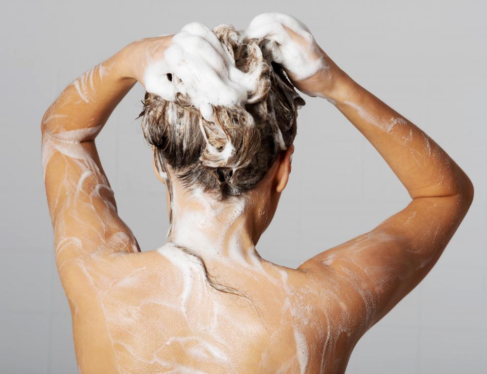An allergic reaction to a new kind of shampoo could cause a tender scalp.