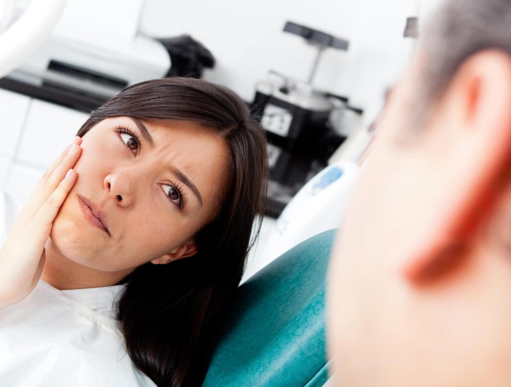 Swollen, tender gums may cause red saliva, and should be evaluated by a dentist.