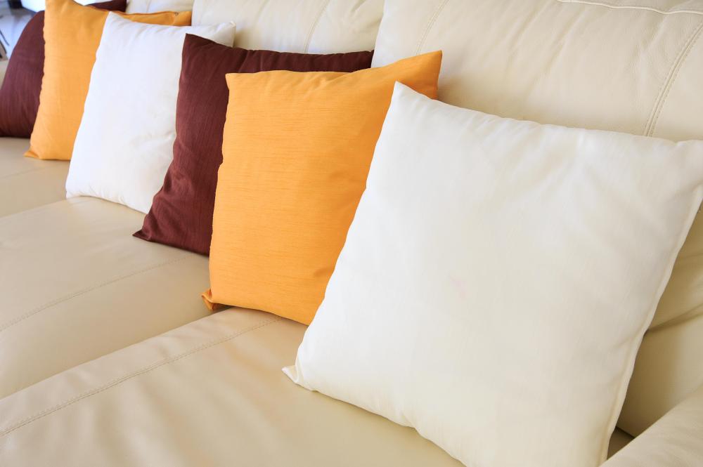 Placing a cushion on a chair before sitting down may help someone avoid hip pain.