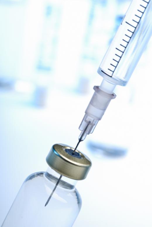 A closeup of the connection between a syringe barrel and needle.