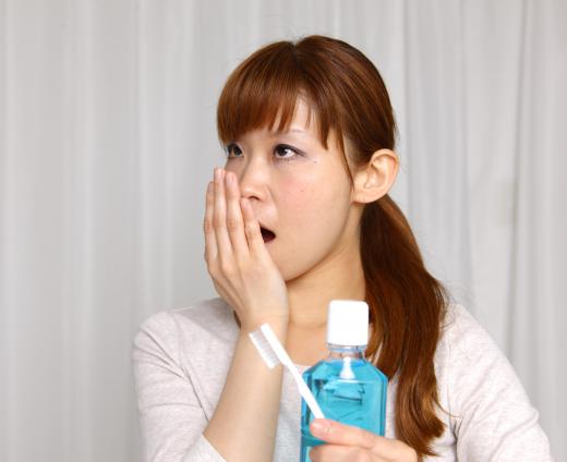 Halitosis, or bad breath, might be caused by yellow saliva buildup.