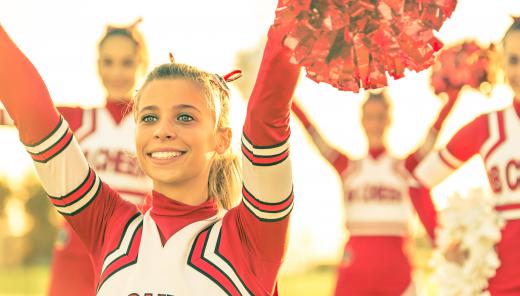 Cheerleaders often perform gymnastic exercises in their routines.