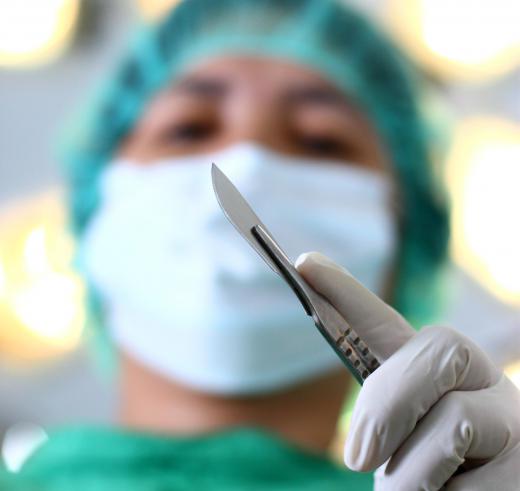 A scalpel is used to cut a stoma in the throat.