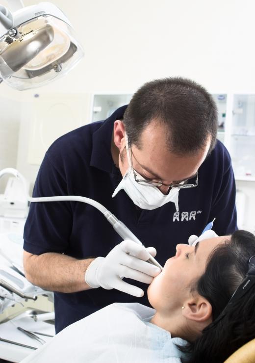 A woman getting her teeth cleaned.