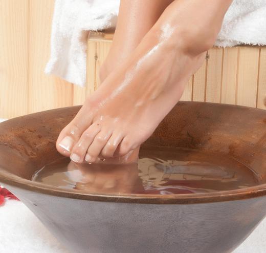 Soaking the affected foot in warm water is one home remedy for toenail treatments.