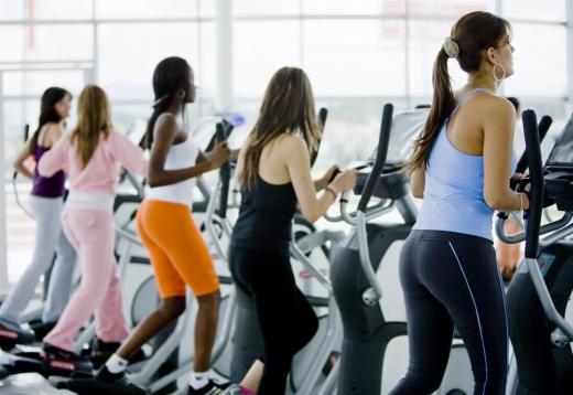 Women on elliptical machines.