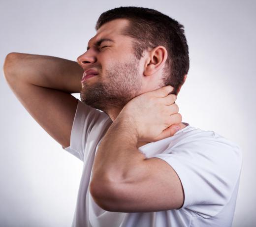 Oromandibular dystonia may cause involuntary contractions in the mouth and neck.