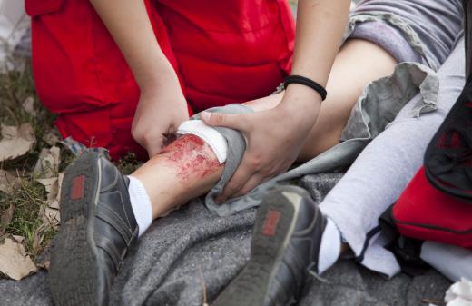 First aid might include stopping a patient from bleeding or immobilizing a limb.