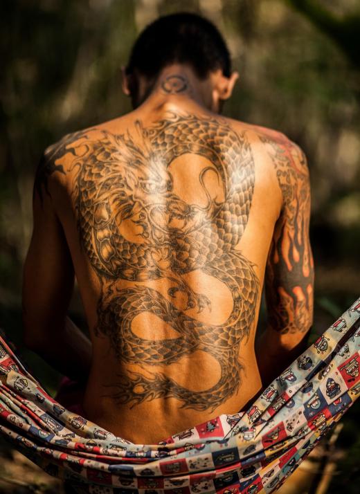 Keeping a new tattoo moisturized can help prevent large scabs from forming that lead to ink loss.