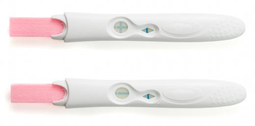 Home pregnancy test showing positive and negative results.