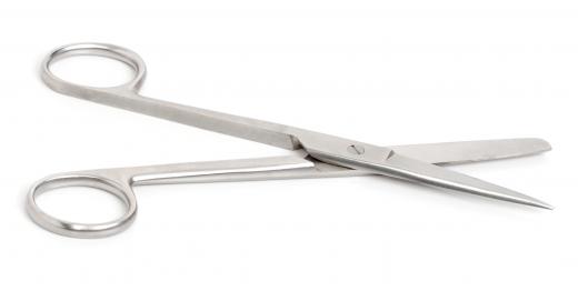 Surgical scissors may be used to remove skin tags.