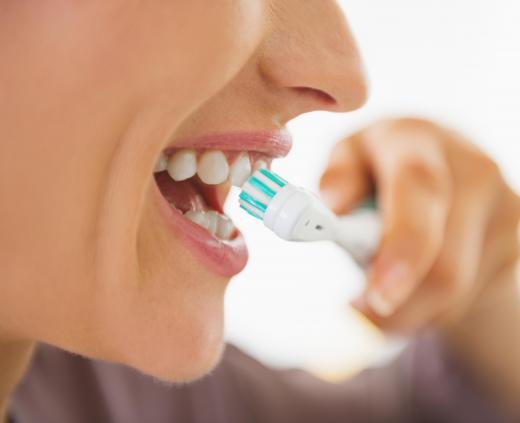 Brushing one's teeth too vigorously can cause bleeding and lead to red saliva.